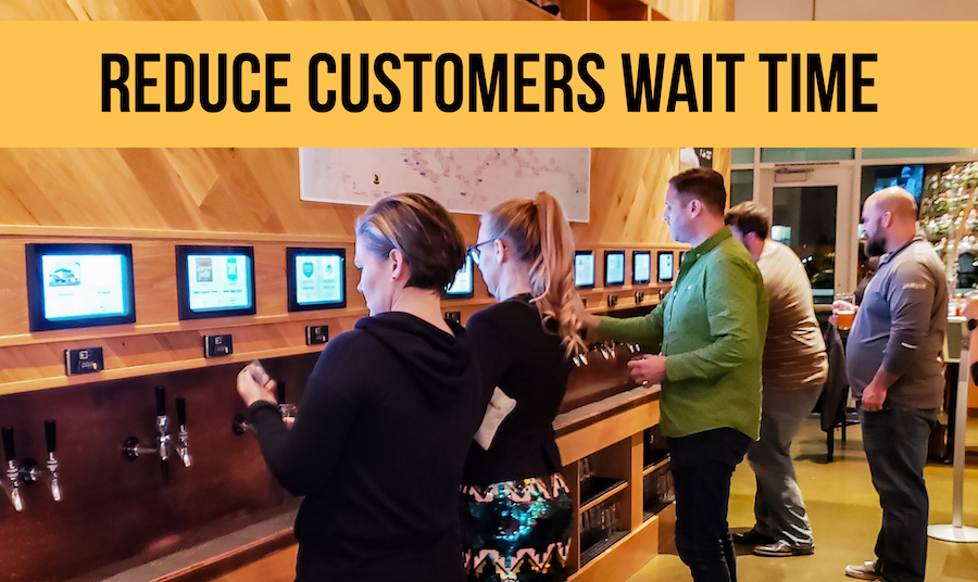 customers pouring drinks using PourMyBeer beverage wall