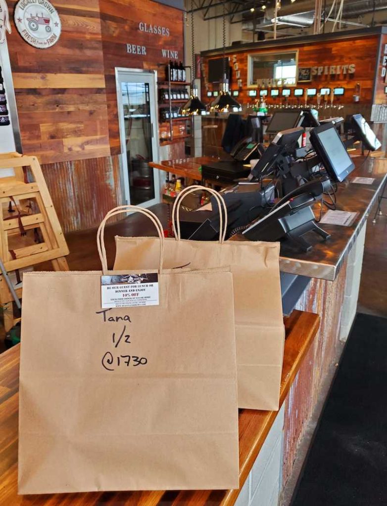 Bar offering bags of takeout during shutdown.