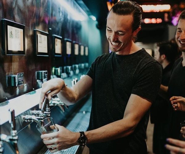 pouring beer with PourMyBeer self-pour system