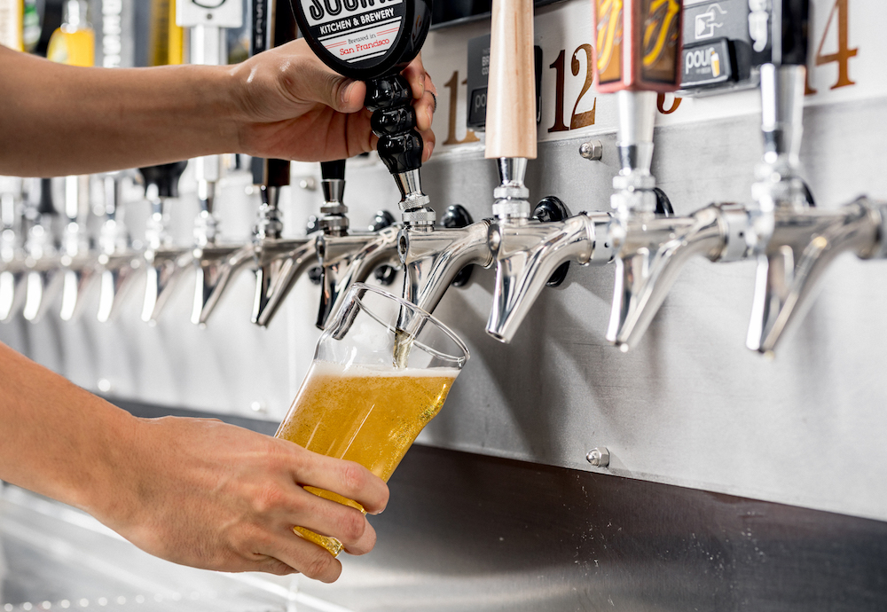 pouring beer with PourMyBeer self-pour system