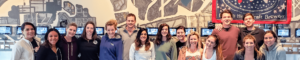 people smiling in front of PourMyBeer beverage wall