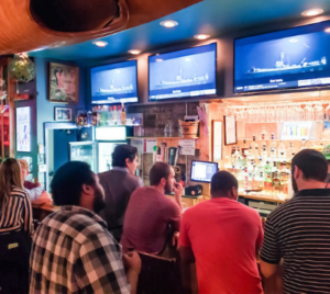 Busy traditional bar with long wait times