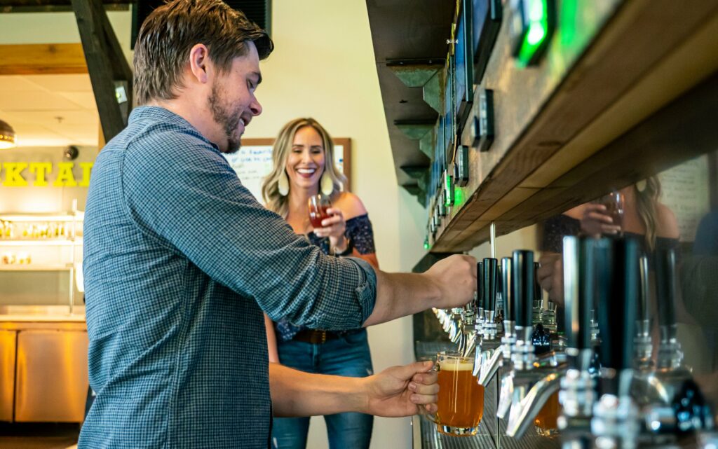 Hop Thief Patrons pouring