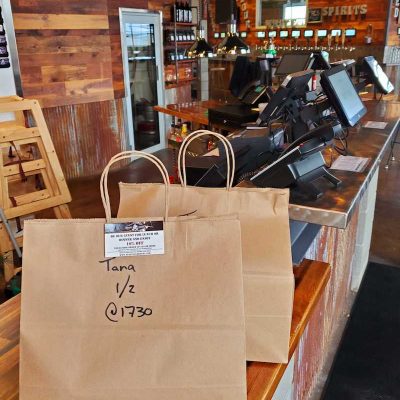 Bar offering bags of takeout during shutdown.